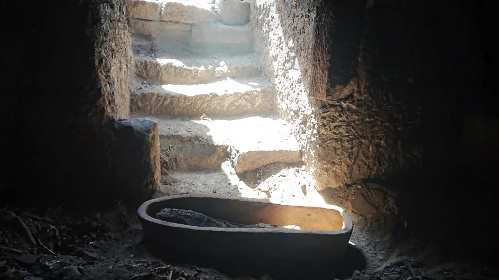 Mummy in coffin in tomb in Aswan