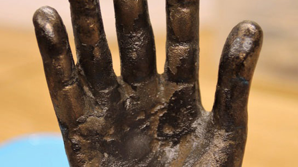 Bronze hand.